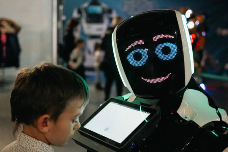 child-interacts-with-friendly-robot-displaying-bla-2026-03-16-00-43-58-utc